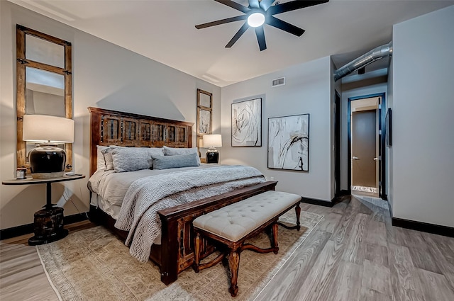 505 Bastrop St Unit 508, Houston, TX 77003 - bedroom with light wood finished floors, baseboards, and a ceiling fan