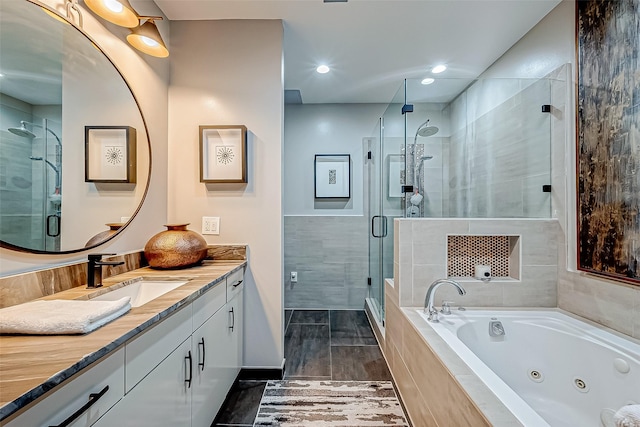 505 Bastrop St Unit 508, Houston, TX 77003 - bathroom with vanity, a jetted tub, and a stall shower