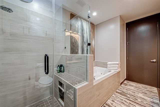 505 Bastrop St Unit 508, Houston, TX 77003 - bathroom featuring a jetted tub and a stall shower