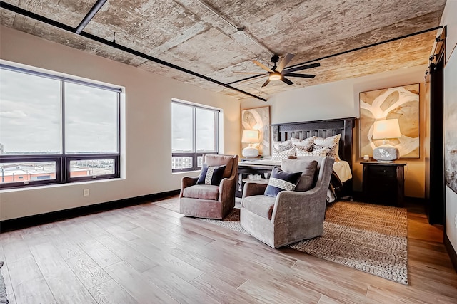 505 Bastrop St Unit 508, Houston, TX 77003 - bedroom with wood finished floors, a ceiling fan, and baseboards