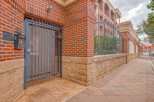 505 Bastrop St Unit 508, Houston, TX 77003 - entrance to property featuring a gate and brick siding