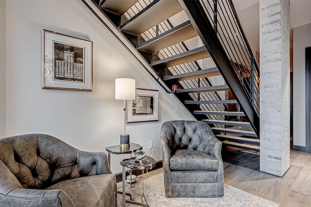505 Bastrop St Unit 508, Houston, TX 77003 - sitting room featuring stairway, wood finished floors, and baseboards