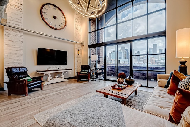 505 Bastrop St Unit 508, Houston, TX 77003 - living room featuring a high ceiling, wood finished floors, and baseboards