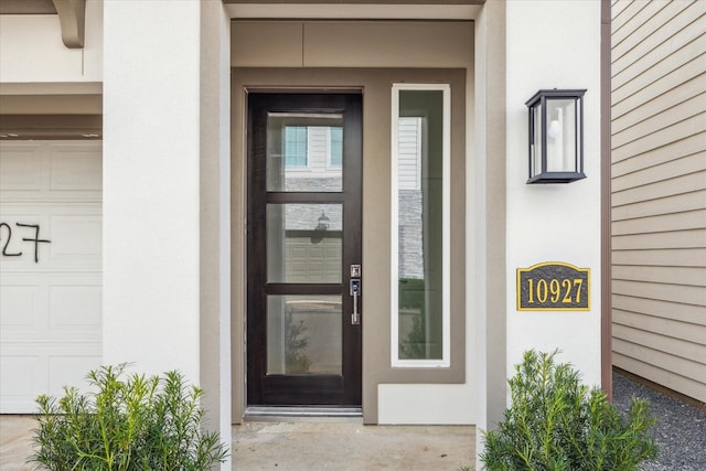 doorway to property with stucco siding