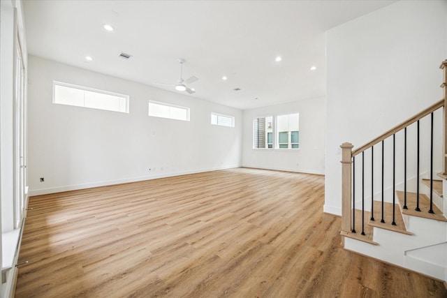 unfurnished room featuring stairs, light wood finished floors, a ceiling fan, and recessed lighting