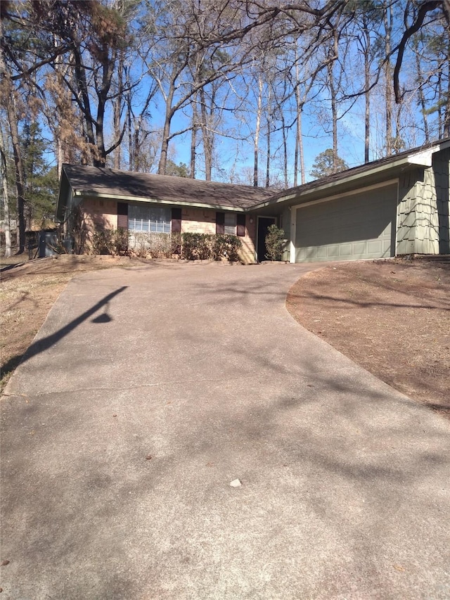 view of front of property with a garage and driveway