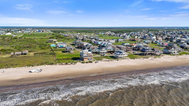birds eye view of property featuring a view of the beach and a water view