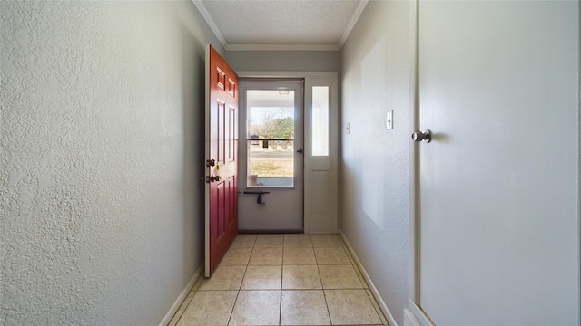 doorway to outside featuring a textured ceiling, a textured wall, ornamental molding, and light tile patterned floors