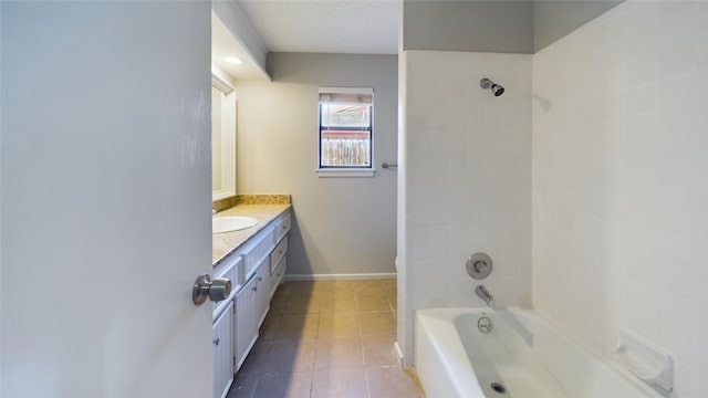 full bath featuring baseboards, bathtub / shower combination, vanity, and tile patterned floors