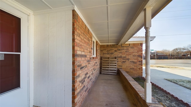 exterior space featuring brick siding