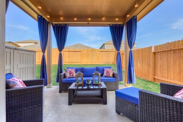 view of patio / terrace featuring a fenced backyard and an outdoor living space