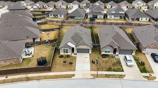 birds eye view of property with a residential view