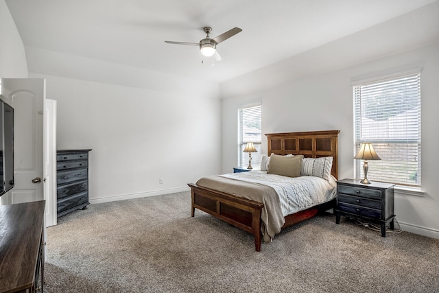 carpeted bedroom featuring ceiling fan and baseboards