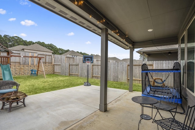 view of patio / terrace featuring a playground and a fenced backyard