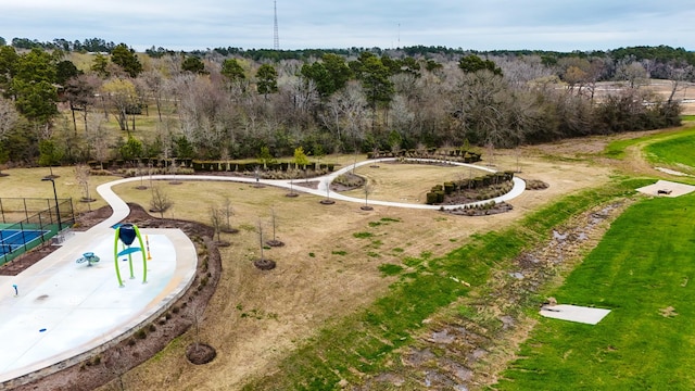 exterior space featuring a wooded view