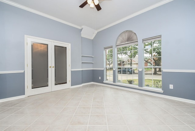 spare room featuring ornamental molding, french doors, baseboards, and light tile patterned floors