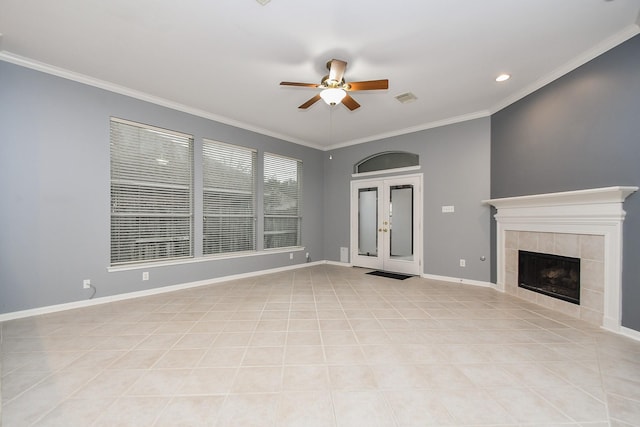 unfurnished living room featuring baseboards, visible vents, ceiling fan, crown molding, and a fireplace