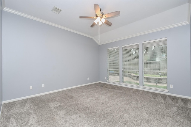 carpeted empty room with ceiling fan, visible vents, baseboards, vaulted ceiling, and ornamental molding