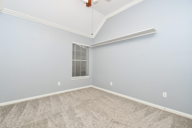 unfurnished room with lofted ceiling, ceiling fan, carpet flooring, baseboards, and crown molding