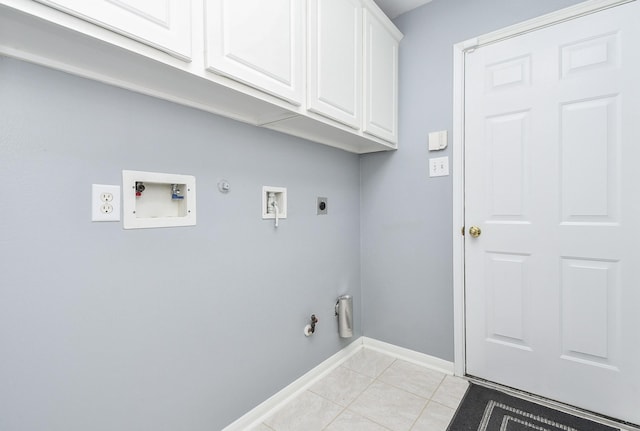 washroom featuring light tile patterned flooring, hookup for a gas dryer, washer hookup, cabinet space, and electric dryer hookup