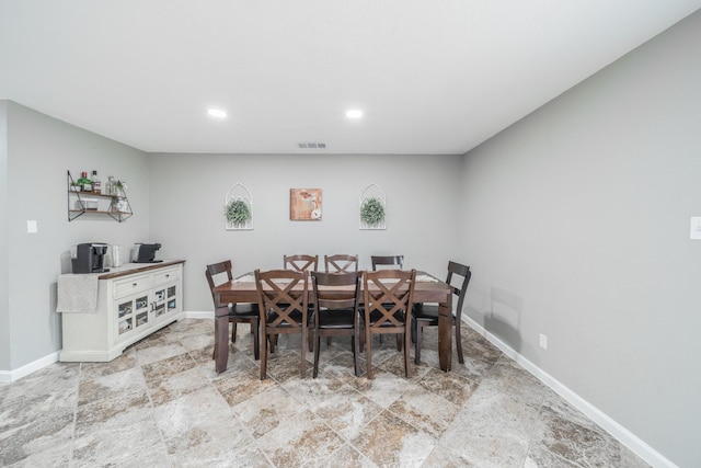 dining room with baseboards, visible vents, and recessed lighting