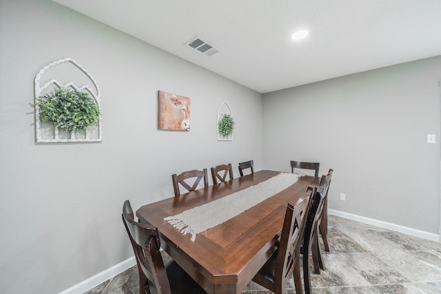 dining space with baseboards and visible vents