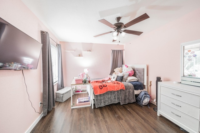 bedroom featuring ceiling fan and dark wood-type flooring