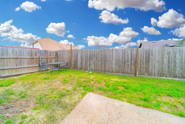 view of yard featuring a fenced backyard