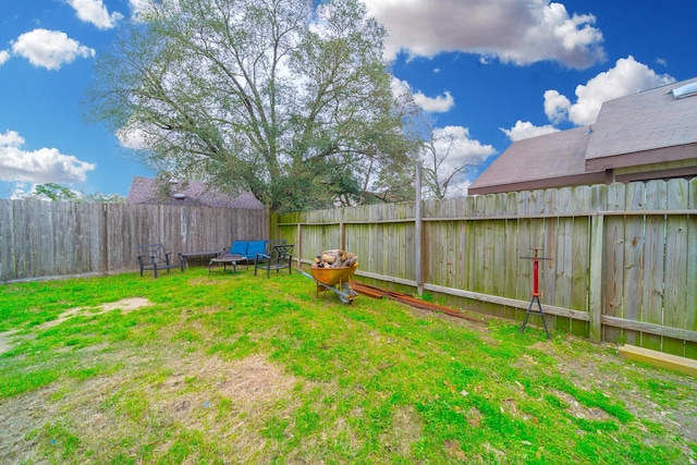 view of yard featuring a fenced backyard