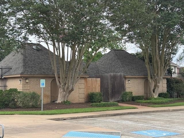exterior space with fence and uncovered parking