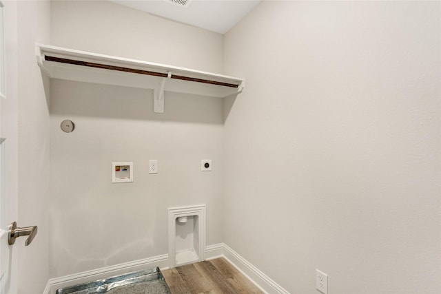 washroom featuring laundry area, baseboards, wood finished floors, hookup for an electric dryer, and washer hookup