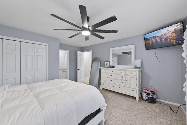 carpeted bedroom featuring baseboards, a closet, and ceiling fan