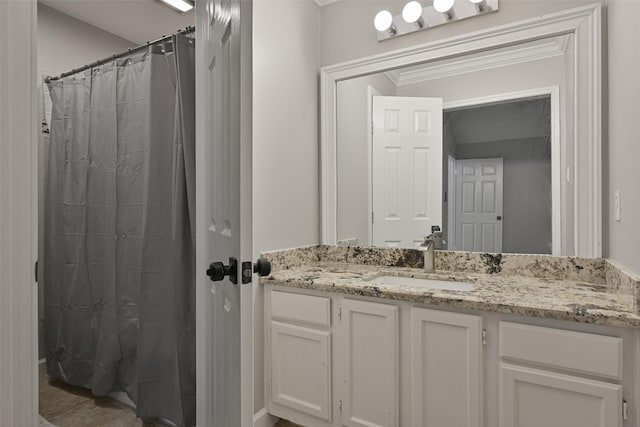 bathroom with a shower with curtain, ornamental molding, and vanity