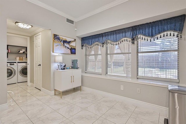 laundry area with crown molding, baseboards, visible vents, and washer and clothes dryer