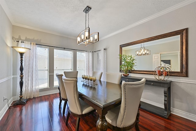 dining space featuring dark wood-type flooring, crown molding, baseboards, and a textured ceiling