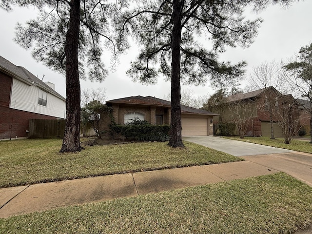 view of front facade with a garage, a front yard, brick siding, and driveway