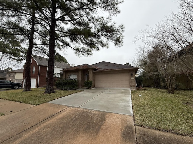 view of front facade featuring driveway, a front lawn, an attached garage, and brick siding