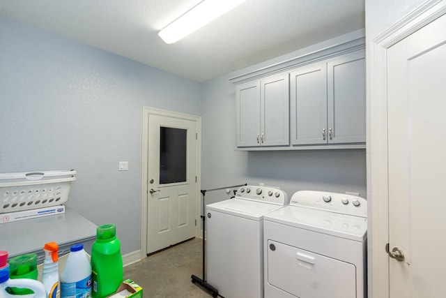 laundry room with cabinet space and washer and clothes dryer