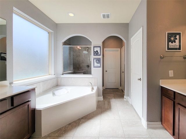 1904 Emerald Breeze Ct, Pearland, TX 77089 - full bath featuring visible vents, baseboards, a tile shower, vanity, and a garden tub