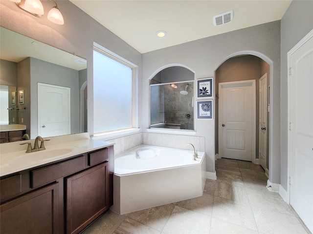 1904 Emerald Breeze Ct, Pearland, TX 77089 - full bathroom with a tile shower, a bath, vanity, visible vents, and baseboards