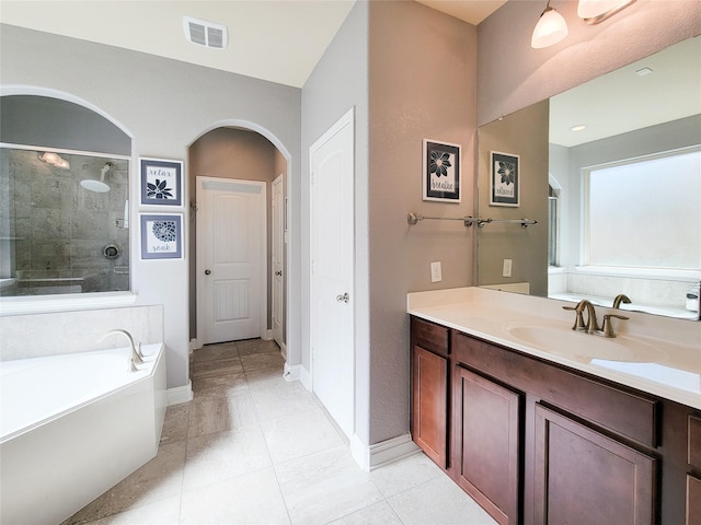 1904 Emerald Breeze Ct, Pearland, TX 77089 - full bathroom featuring vanity, baseboards, tiled shower, visible vents, and a bath