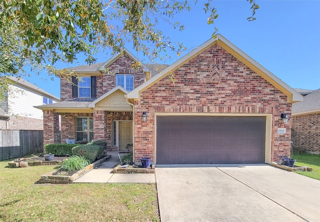 view of front of property featuring a front lawn, driveway, fence, a garage, and brick siding