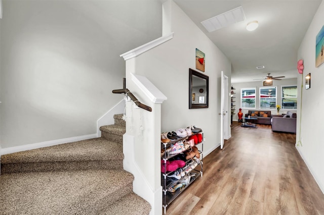 interior space with wood finished floors, visible vents, and baseboards