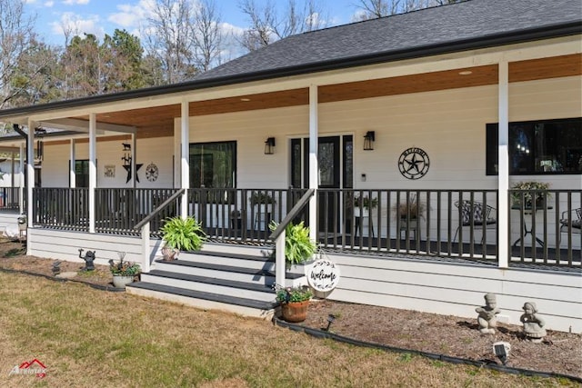 exterior space with a porch and a shingled roof