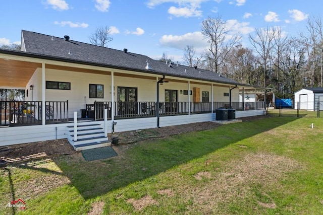 6270 US Highway 259 N, Naples, TX 75568 - back of property featuring roof with shingles and a lawn