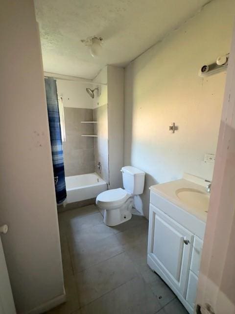 bathroom with vanity, toilet, shower / bath combo, and tile patterned flooring
