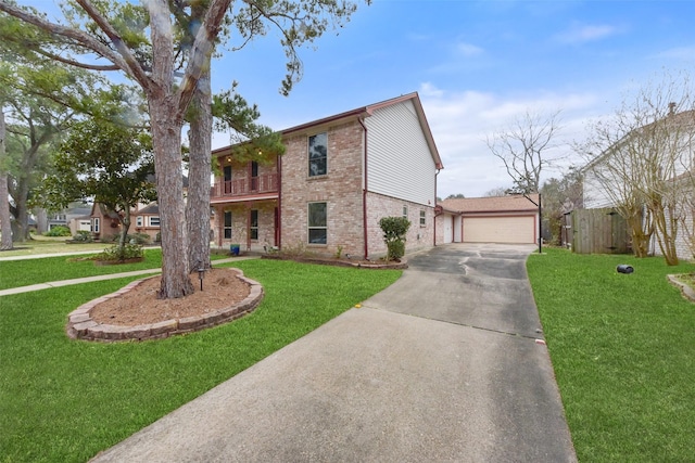 view of front of property with brick siding, fence, a detached garage, and a front lawn