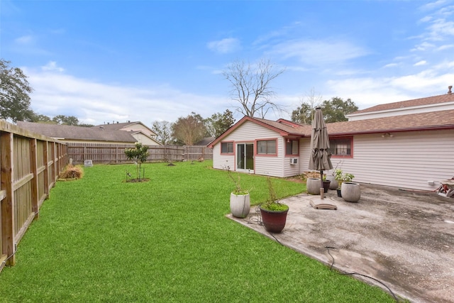 view of yard featuring a patio and a fenced backyard