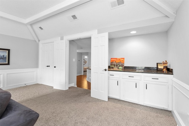 8014 Northbridge Cir, Spring, TX 77379 - bar with light colored carpet, wainscoting, and recessed lighting