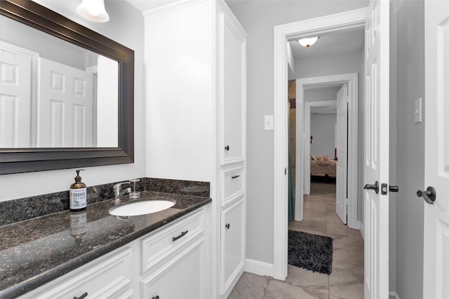 8014 Northbridge Cir, Spring, TX 77379 - bathroom with vanity, baseboards, and tile patterned floors